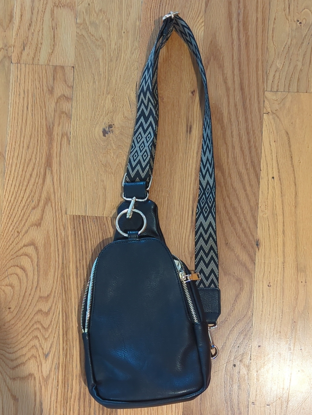 Moda Luxe Black Leather Sling Bag with Patterned Strap